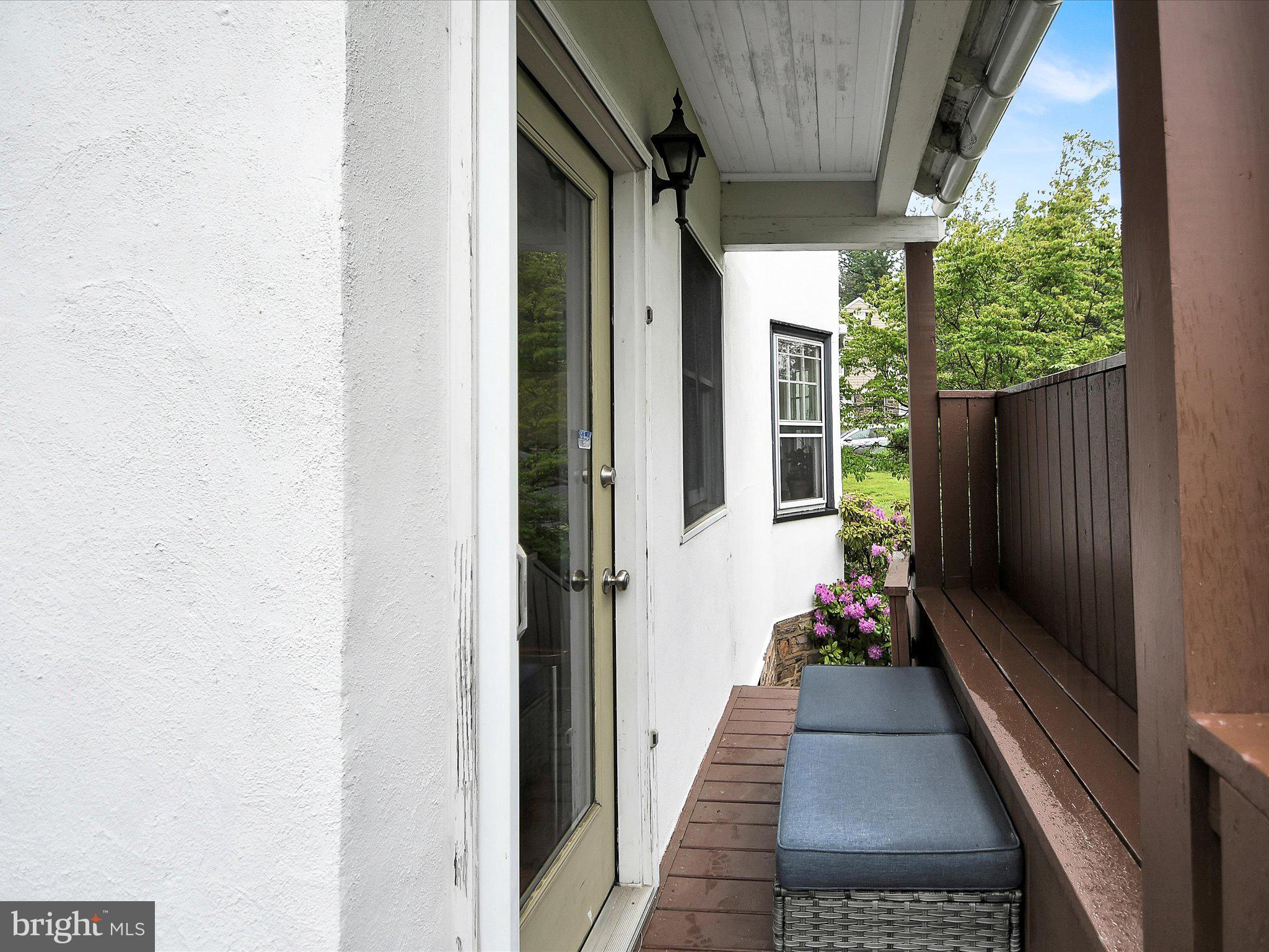 3 Bells Mill Road Glenside, PA 19038 - Photo 33 of 38 a view of a porch with wooden floor