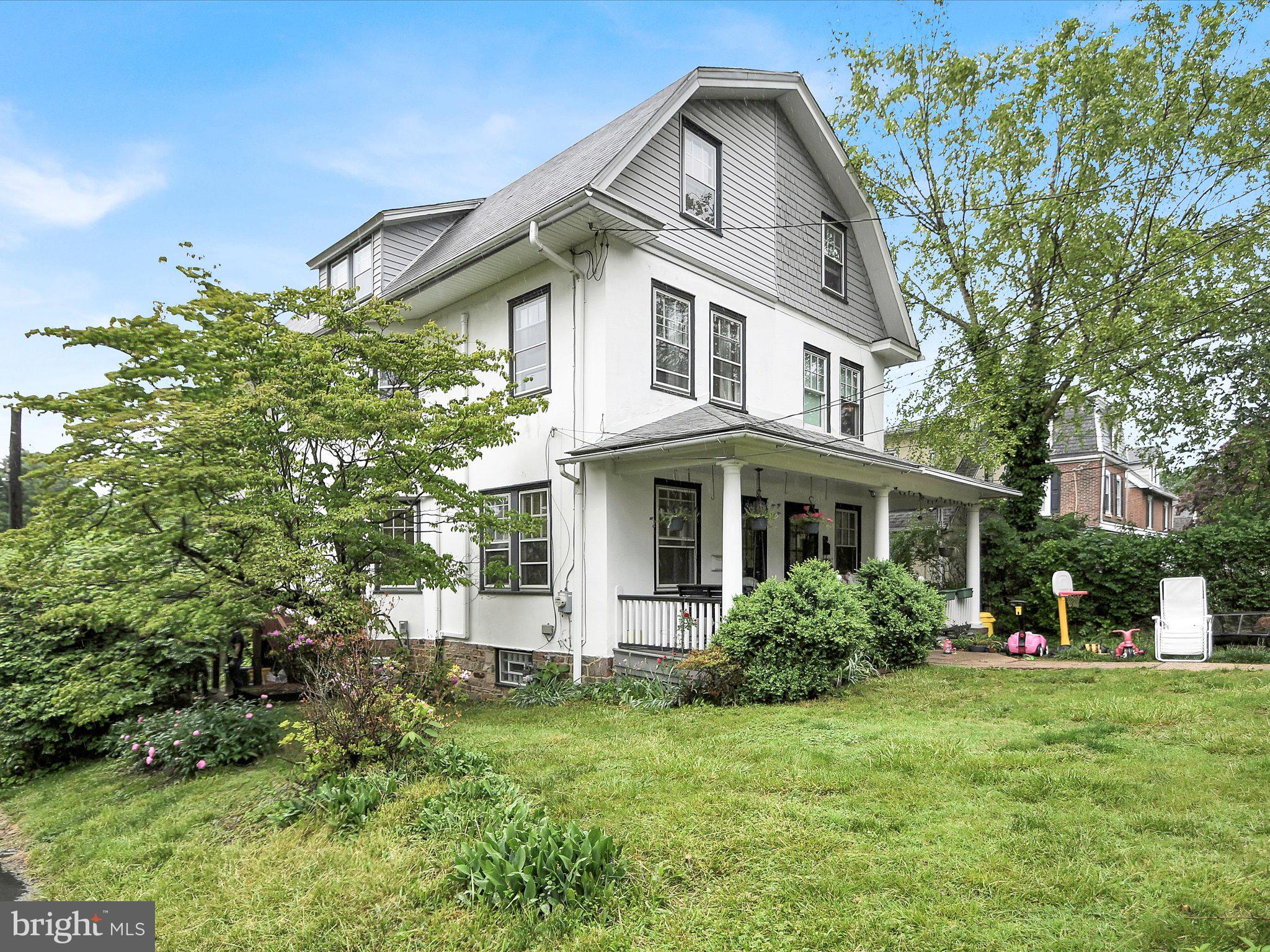 3 Bells Mill Road Glenside, PA 19038 - Photo 4 of 38 a front view of a house with a garden