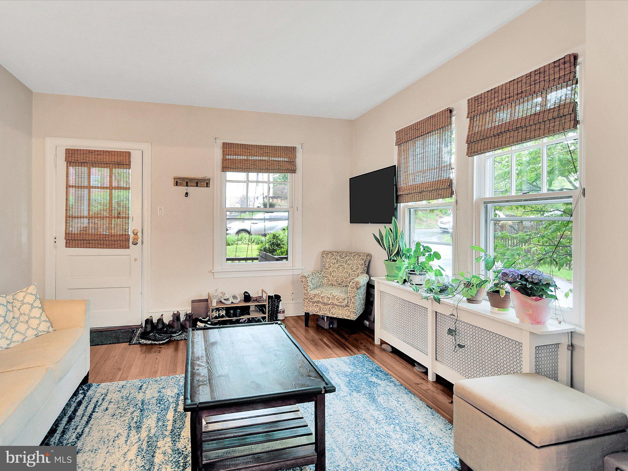 3 Bells Mill Road Glenside, PA 19038 - Photo 10 of 38 a living room with furniture and a flat screen tv