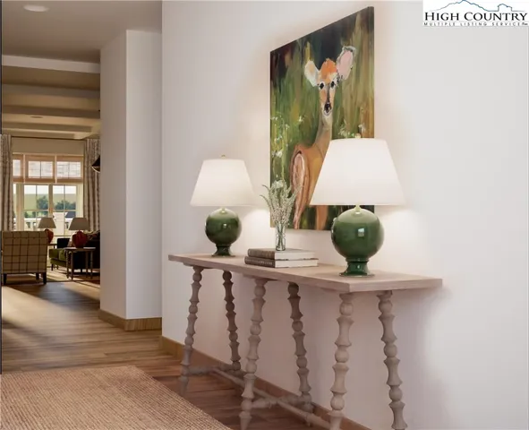 a view of living room with furniture and wooden floor