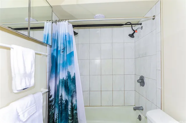a bathroom with a shower and a tub