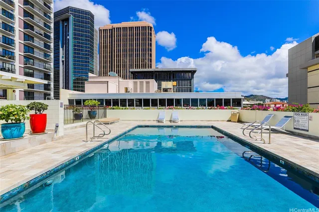 a view of a swimming pool with a lounge chairs
