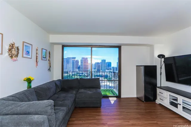a living room with furniture and a flat screen tv