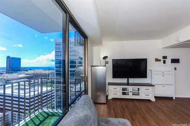 a view of a livingroom with furniture and flat screen tv