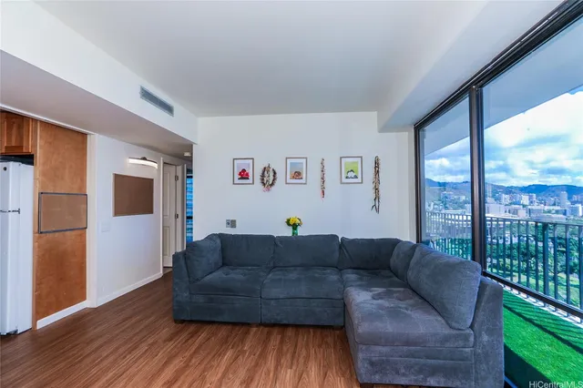 a living room with furniture and a window