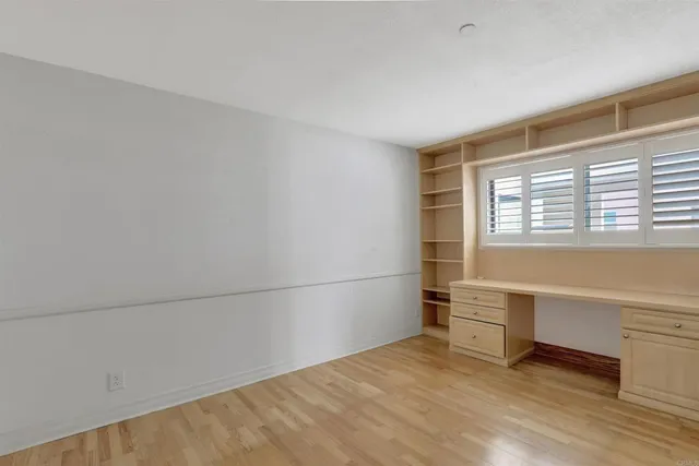 a bathroom with a granite countertop sink shower and a mirror
