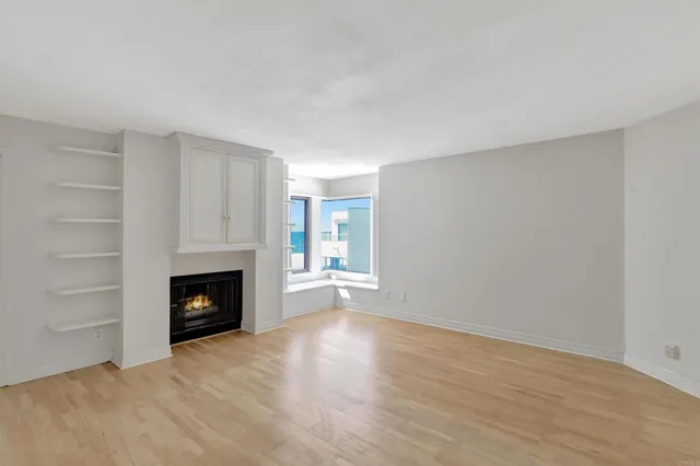 a view of closet with wooden floor