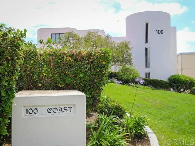 a view of a terrace with wooden floor and a pot