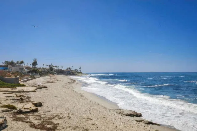 a view of a swimming pool with an outdoor seating space