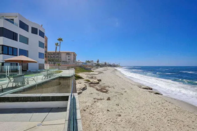 a view of a patio with a table and chairs