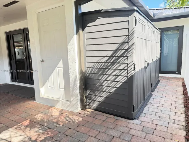 a kitchen with a appliances and cabinets