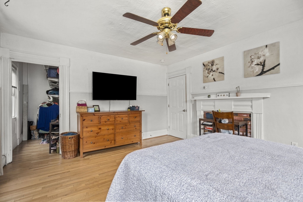 145 High Street, Unit 2 Danvers, MA 01923 - Photo 12 of 40 a bedroom with furniture and a flat screen tv