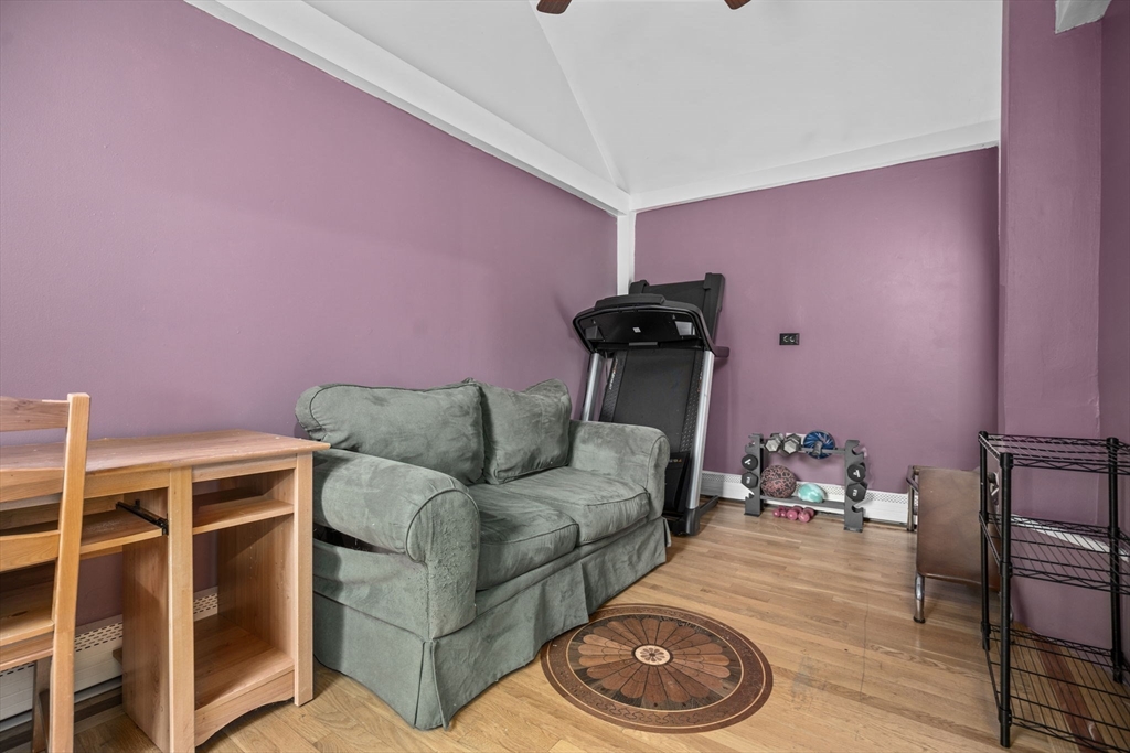 145 High Street, Unit 2 Danvers, MA 01923 - Photo 13 of 40 a living room with furniture a rug and a window