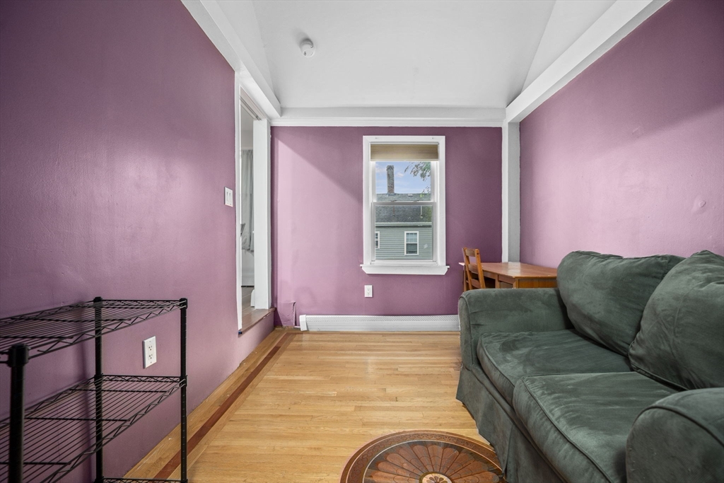145 High Street, Unit 2 Danvers, MA 01923 - Photo 14 of 40 a living room with furniture and a window
