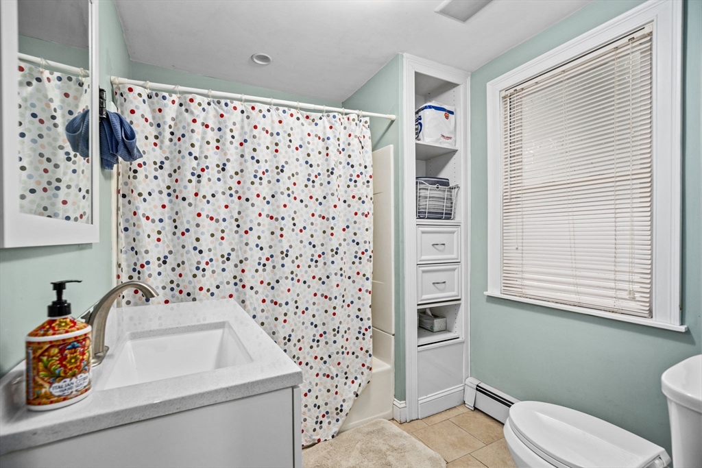 145 High Street, Unit 2 Danvers, MA 01923 - Photo 15 of 40 a bathroom with a sink toilet and shower