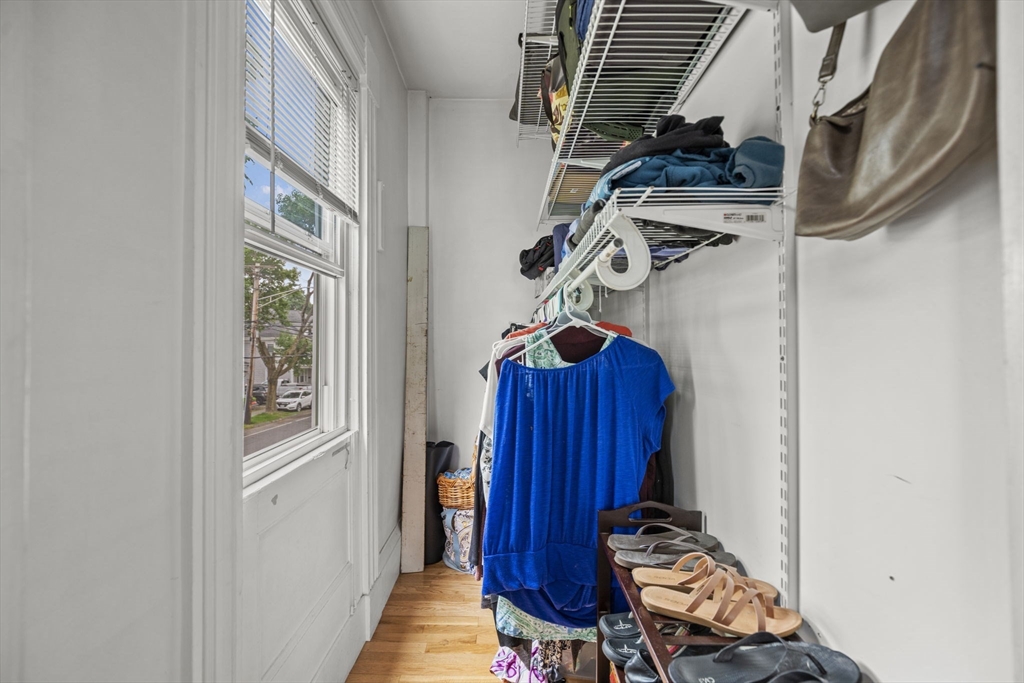 145 High Street, Unit 2 Danvers, MA 01923 - Photo 19 of 40 a view of a hallway with wooden floor and windows