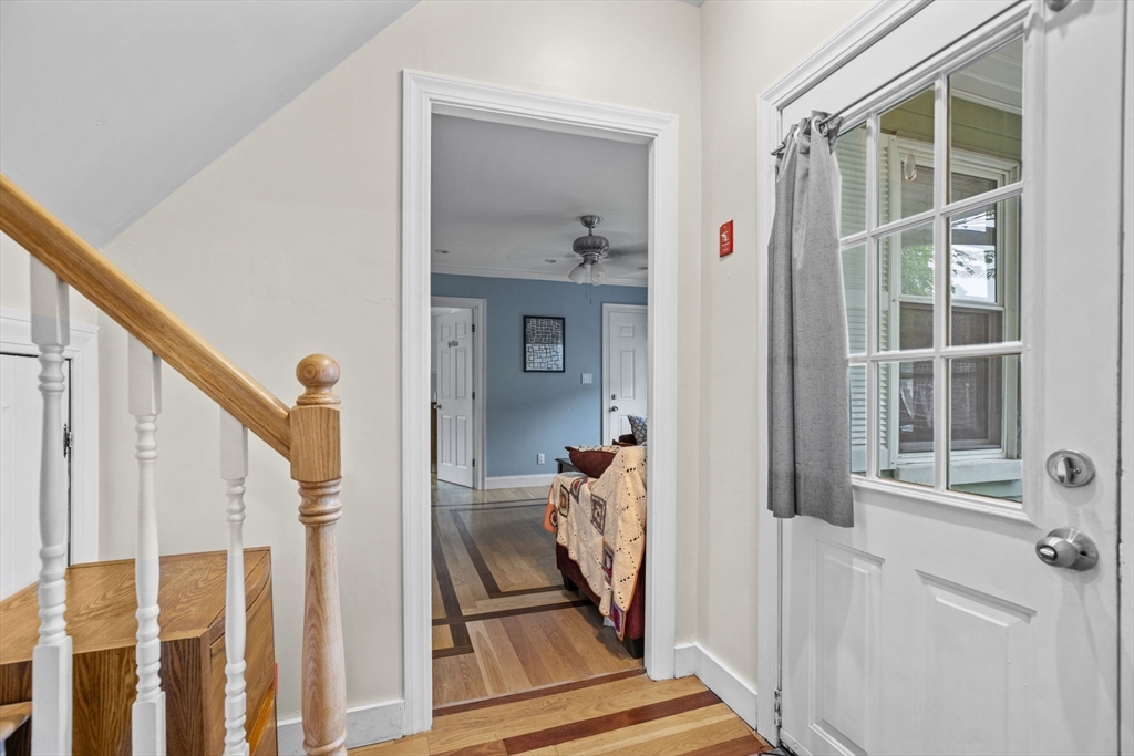 145 High Street, Unit 2 Danvers, MA 01923 - Photo 20 of 40 a view of a hallway with wooden floor and staircase