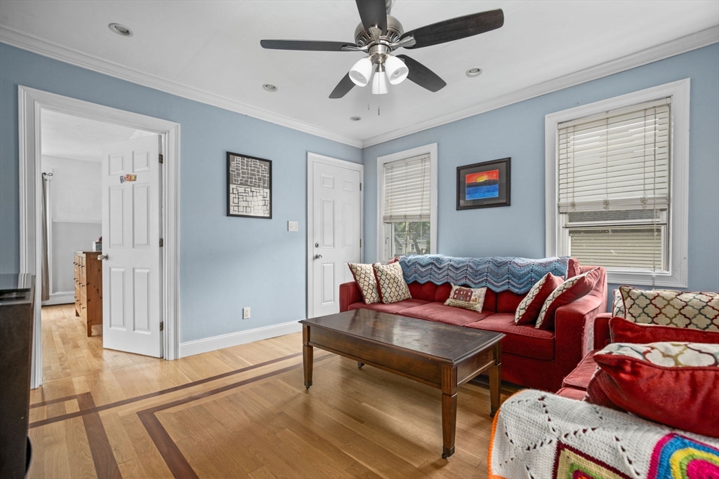 145 High Street, Unit 2 Danvers, MA 01923 - Photo 2 of 40 a living room with furniture and a window