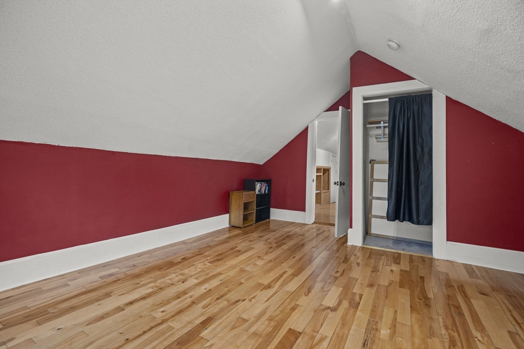 145 High Street, Unit 2 Danvers, MA 01923 - Photo 23 of 40 a view of an empty room with wooden floor