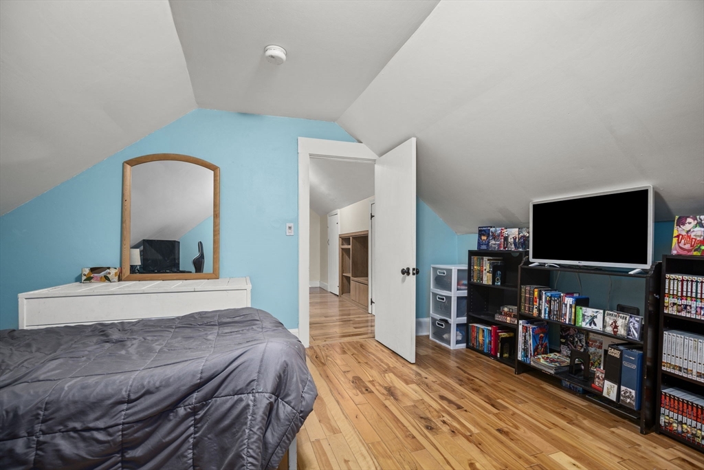 145 High Street, Unit 2 Danvers, MA 01923 - Photo 25 of 40 a bedroom with bed and a flat screen tv