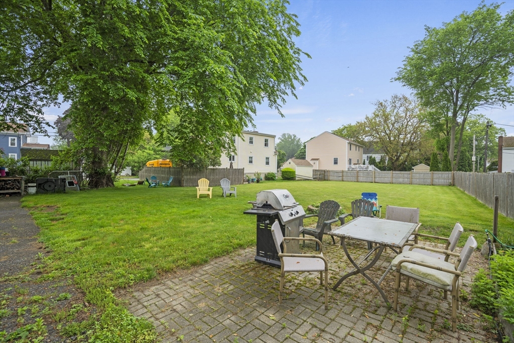 145 High Street, Unit 2 Danvers, MA 01923 - Photo 30 of 40 a view of a chairs and table in a yard