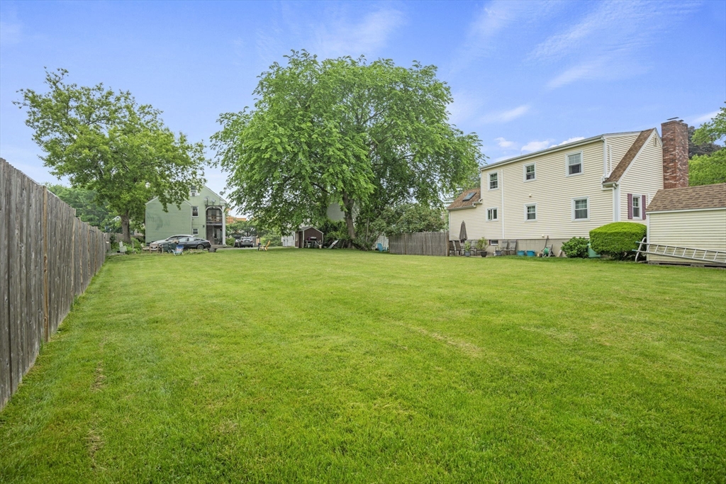 145 High Street, Unit 2 Danvers, MA 01923 - Photo 31 of 40 a view of a house with a yard