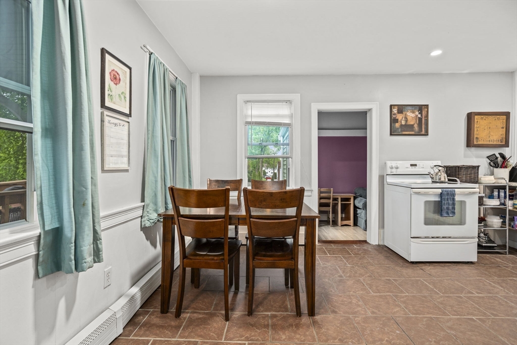 145 High Street, Unit 2 Danvers, MA 01923 - Photo 8 of 40 a view of a dining room with furniture and a window