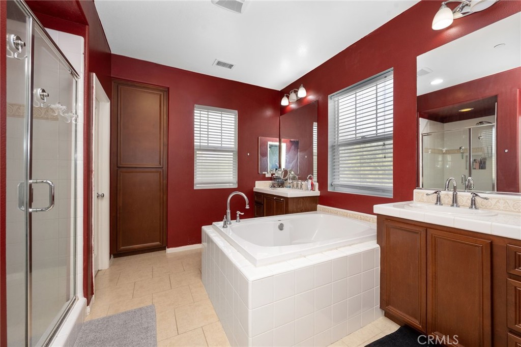3257 Moss Landing Boulevard Oxnard, CA 93036 - Photo 13 of 29 a bathroom with a tub sink and mirror