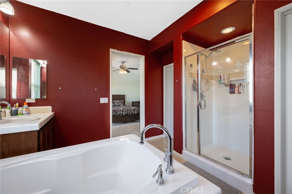 3257 Moss Landing Boulevard Oxnard, CA 93036 - Photo 14 of 29 a en suite bathroom with a sink shower and a mirror