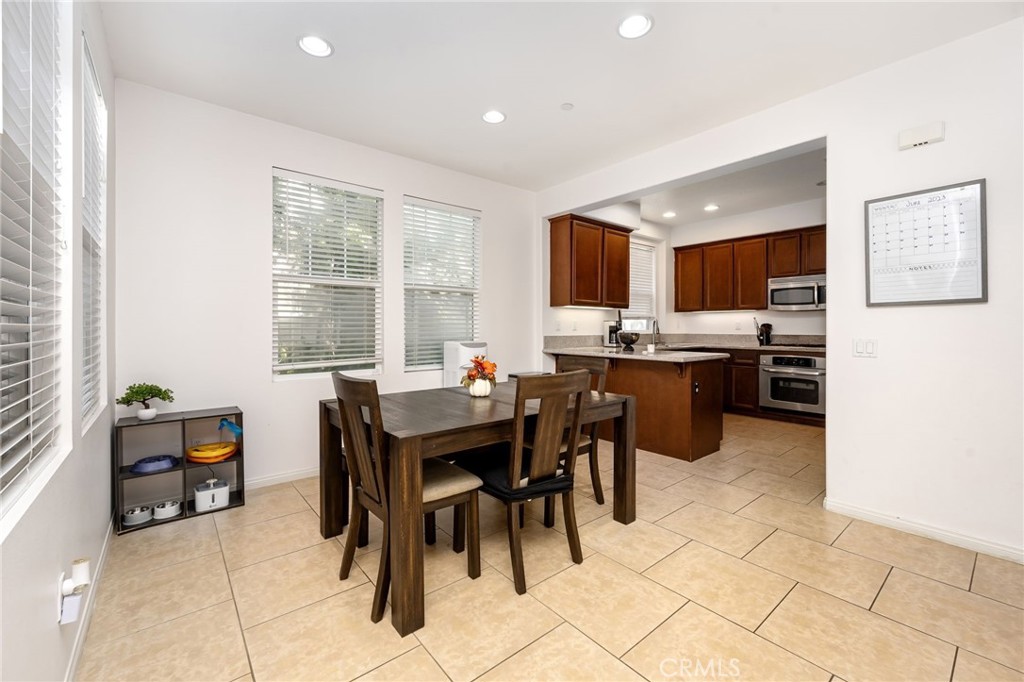 3257 Moss Landing Boulevard Oxnard, CA 93036 - Photo 19 of 29 a kitchen with stainless steel appliances kitchen island granite countertop a sink and cabinets