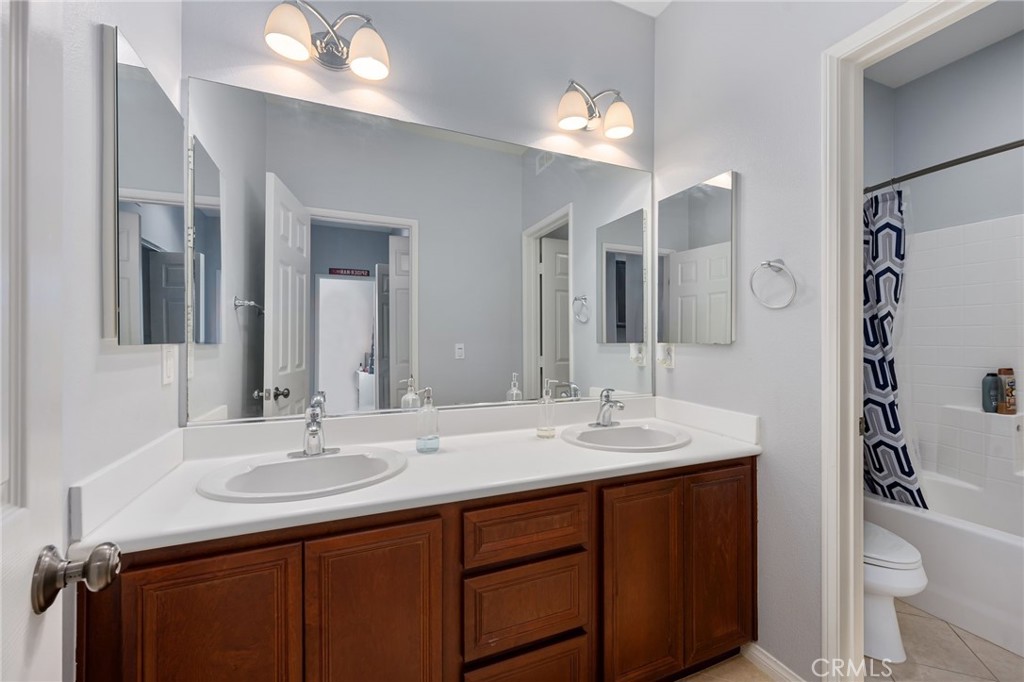 3257 Moss Landing Boulevard Oxnard, CA 93036 - Photo 3 of 29 a bathroom with a sink and a mirror