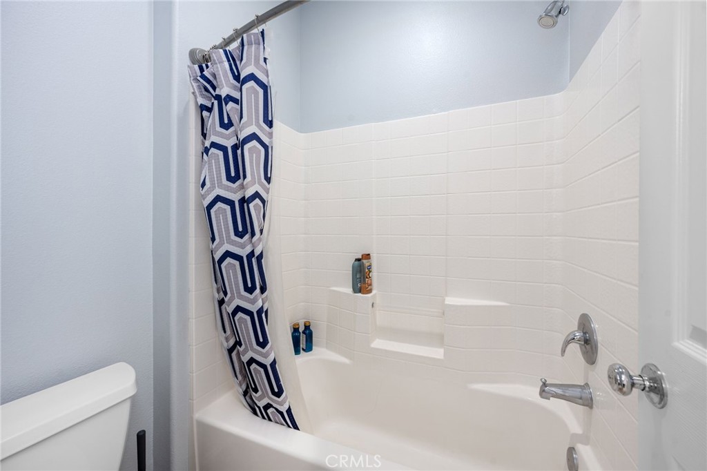 3257 Moss Landing Boulevard Oxnard, CA 93036 - Photo 4 of 29 a bathroom with a bathtub and a shower