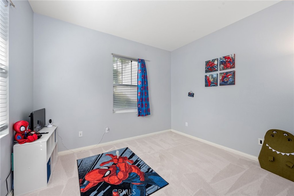 3257 Moss Landing Boulevard Oxnard, CA 93036 - Photo 5 of 29 a bedroom with a bed and cabinets