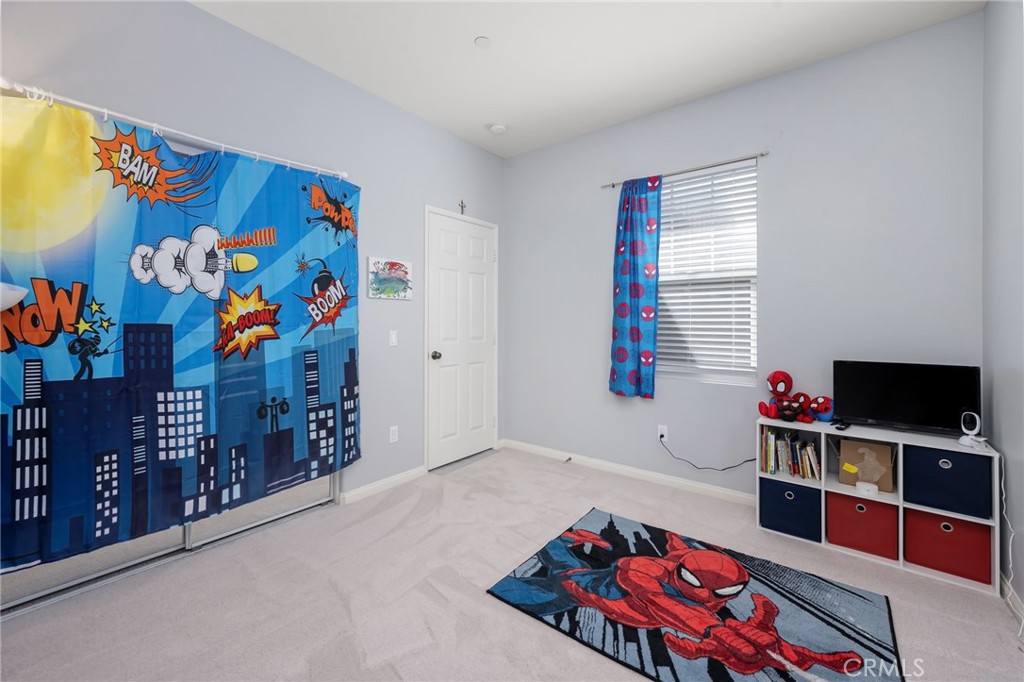 3257 Moss Landing Boulevard Oxnard, CA 93036 - Photo 6 of 29 a bedroom with furniture and a flat screen tv