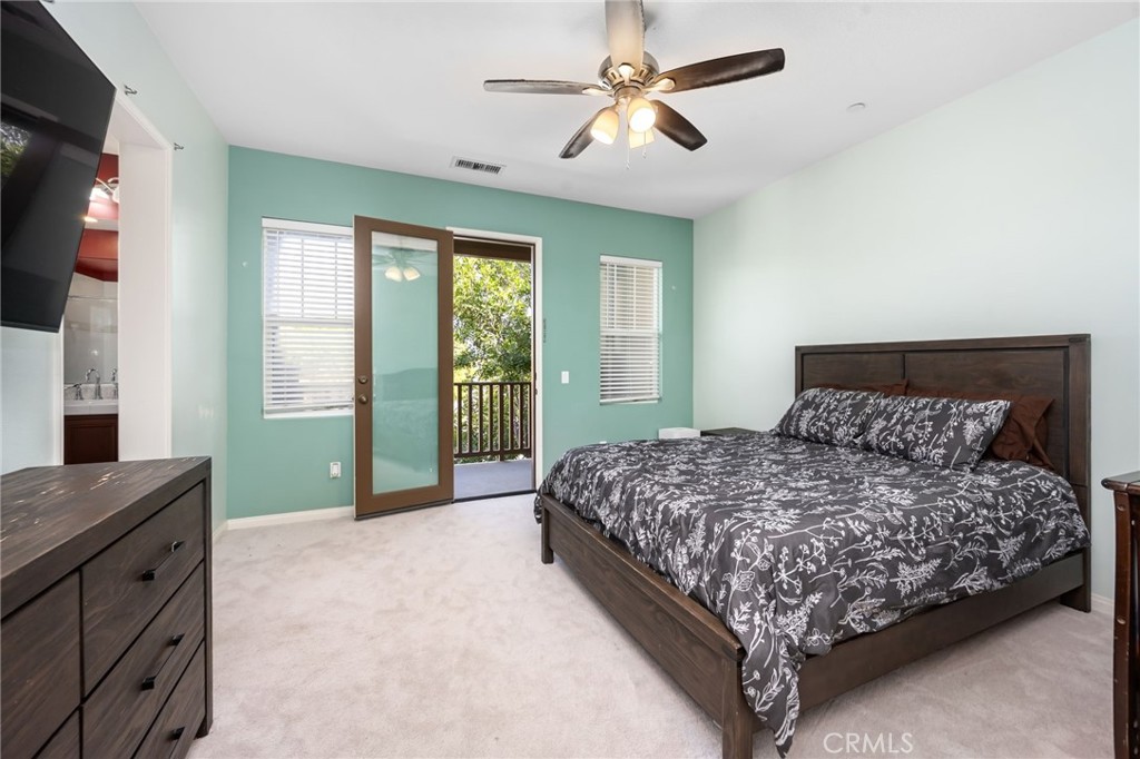 3257 Moss Landing Boulevard Oxnard, CA 93036 - Photo 10 of 29 a bedroom with a large bed and a flat tv screen on dresser