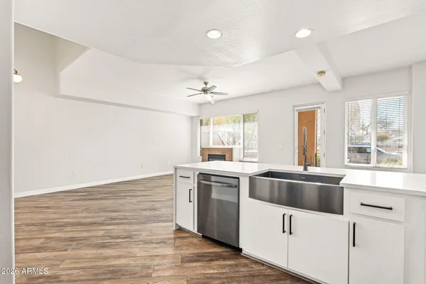 a kitchen with stainless steel appliances granite countertop a stove and a sink