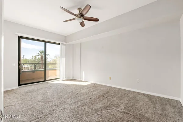 a view of an empty room with a window
