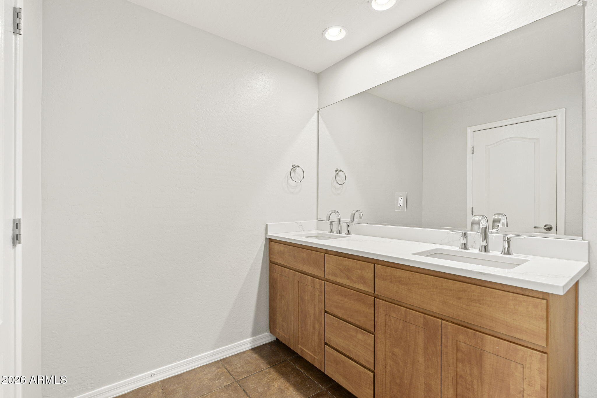 16 West Encanto Boulevard, Unit 12 Phoenix, AZ 85003 - Photo 22 of 42 a bathroom with a sink and a mirror