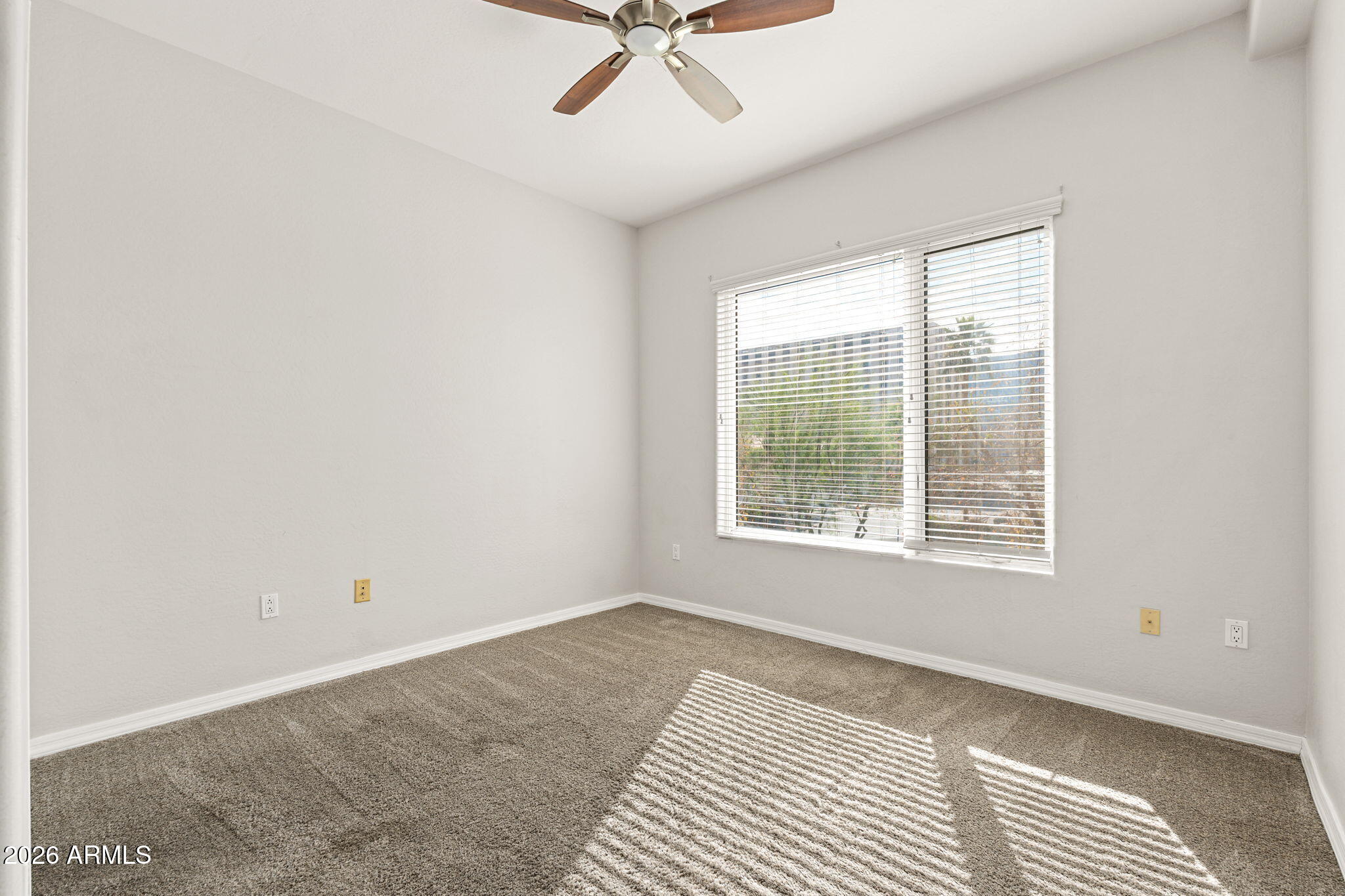 16 West Encanto Boulevard, Unit 12 Phoenix, AZ 85003 - Photo 24 of 42 a view of an empty room with a window
