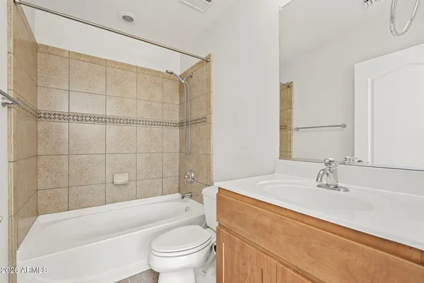 a bathroom with a sink a toilet and bathtub