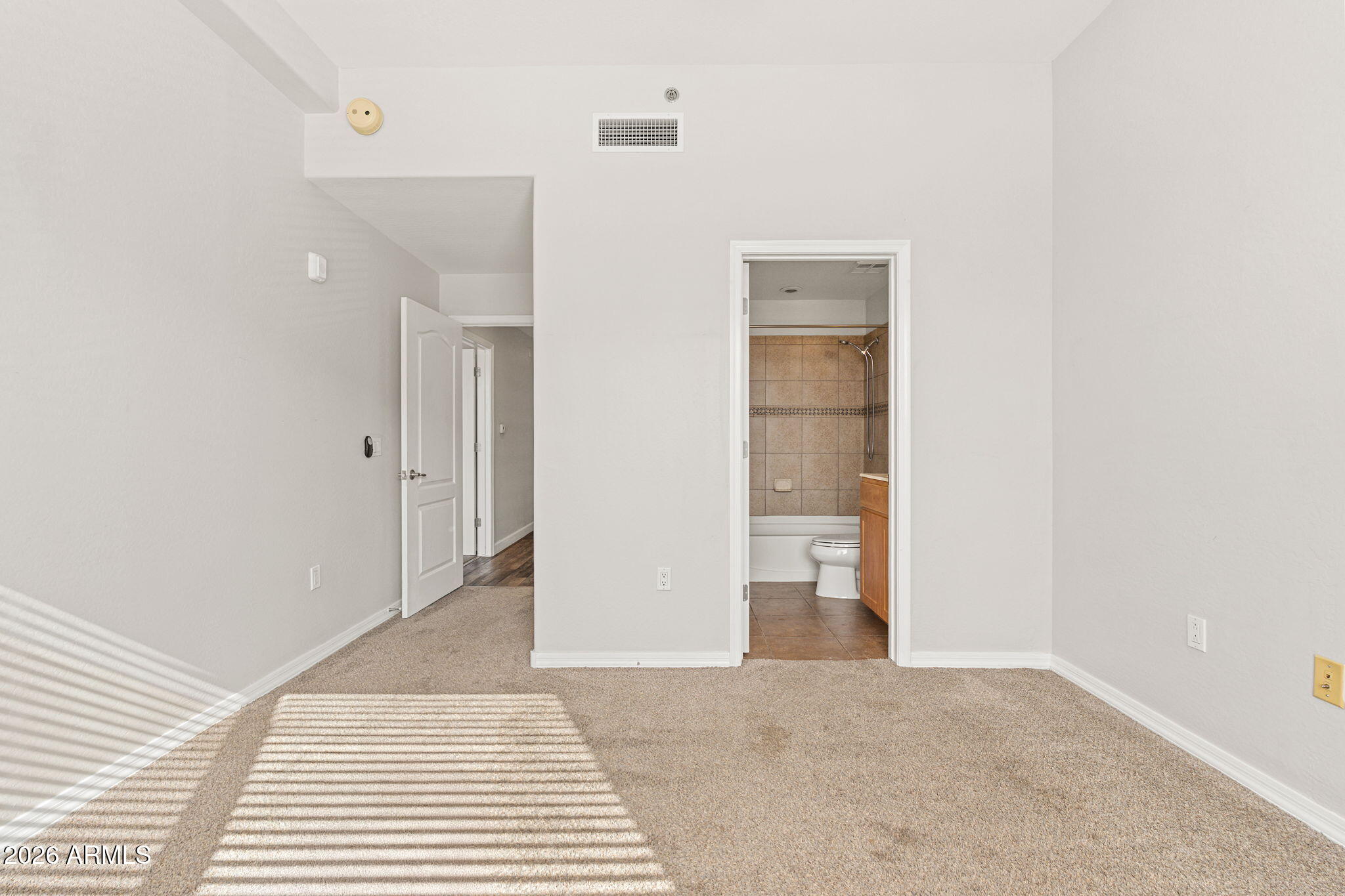 16 West Encanto Boulevard, Unit 12 Phoenix, AZ 85003 - Photo 26 of 42 a view of a big room with closet and mirror