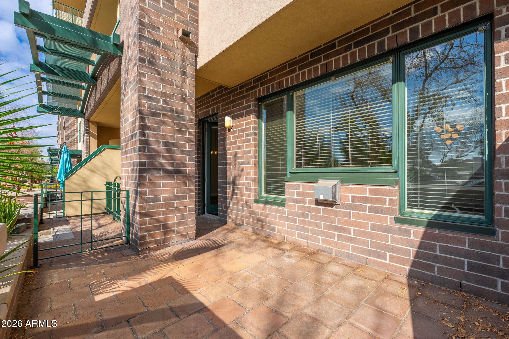 16 West Encanto Boulevard, Unit 12 Phoenix, AZ 85003 - Photo 30 of 42 a view of a brick house with a large window