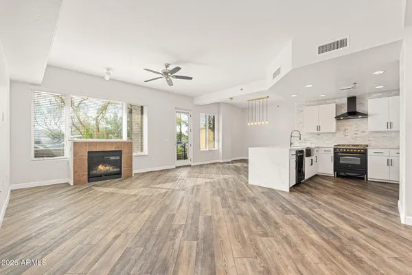 a view of kitchen with furniture fireplace and window