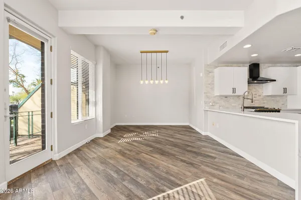 a view of a kitchen with windows