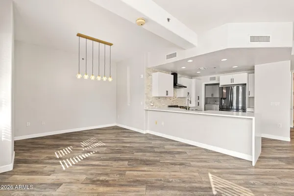 a view of kitchen with wooden floor