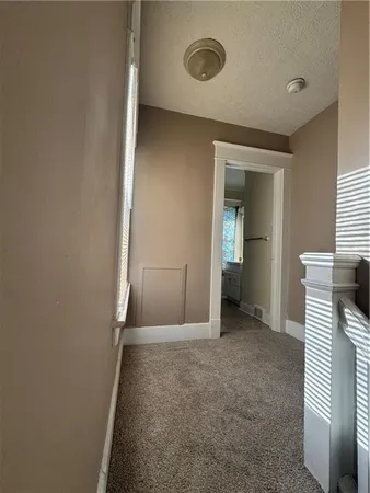 a view of hallway with stairs