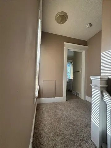 a view of hallway with stairs