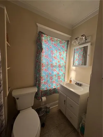 a bedroom with bed and window