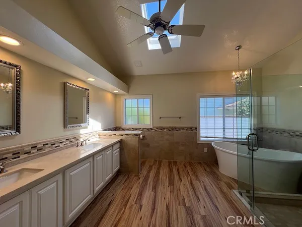a bathroom with a bathtub shower sink and toilet