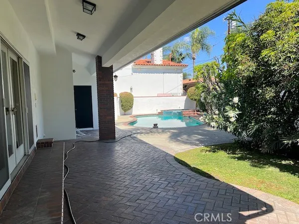 a view of a house with a yard porch and sitting area